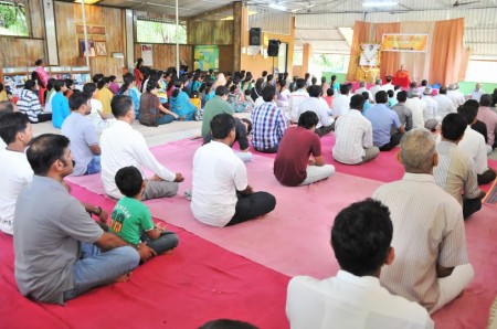 Devotees listening to Swami Prajnanamritananda